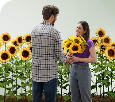 A couple holding a bouquet of sunflowers