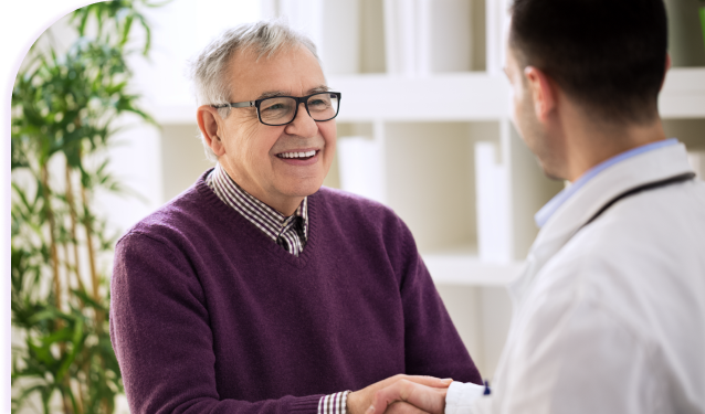 Smiling patient shaking hands with doctor
