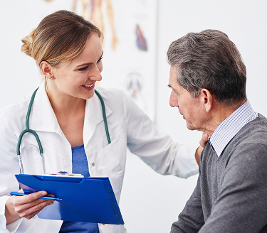 Patient and smiling doctor