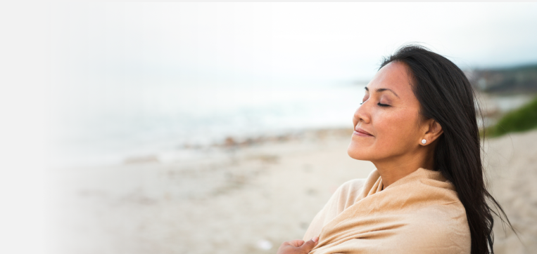 Woman on a sandy beach relaxing