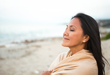 Woman on a sandy beach relaxing