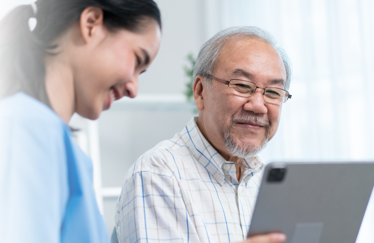An older man is being medically consulted by a young nurse